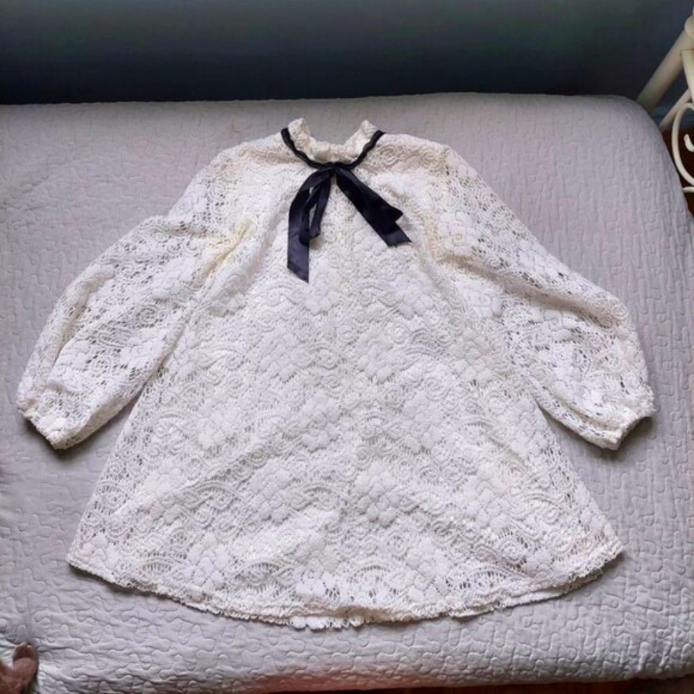 Lace Victorian style mini dress with high neck and collar bow
